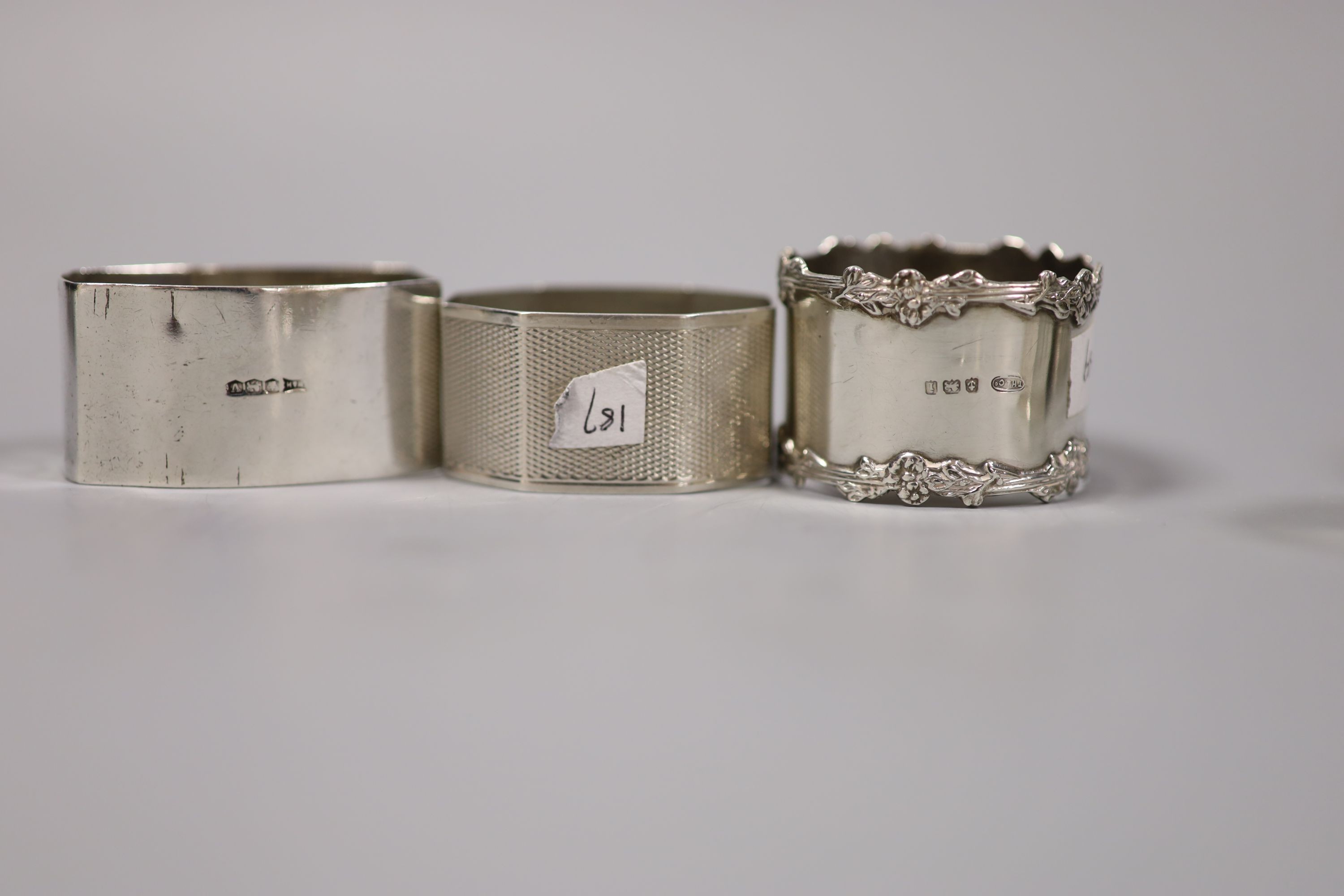 Nine assorted silver napkin rings, 7oz.